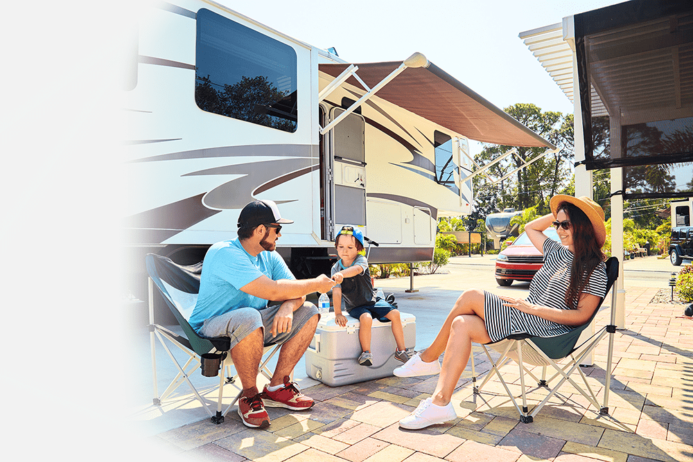 Family outside RV in RV park