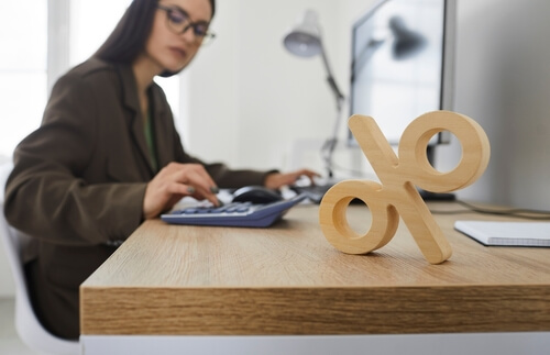 woman calculating interest rates for a new boat loan